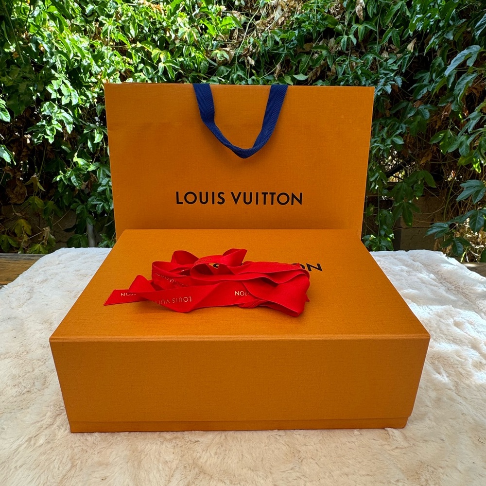 Louis Vuitton box, shopping bag and ribbon.